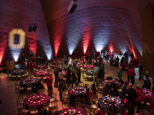 event with round tables and a Block O on the wall