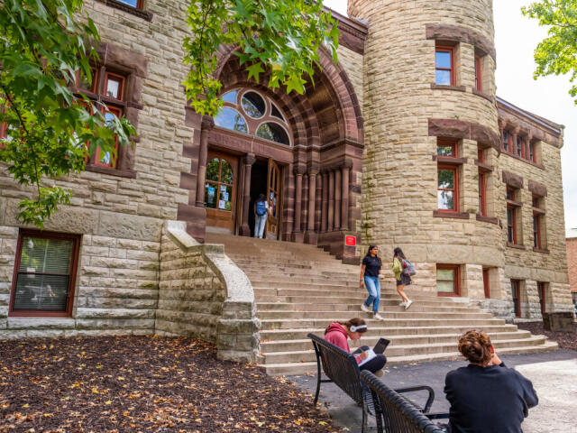 Plaza in front of Orton Hall with students sitting and walking