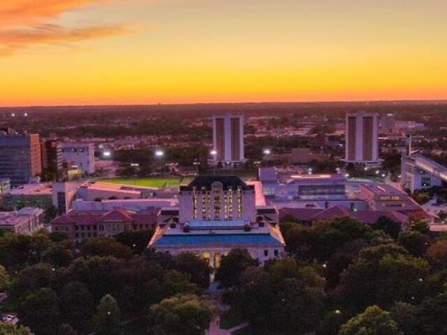 the sun has just set looking west past Thompson Library